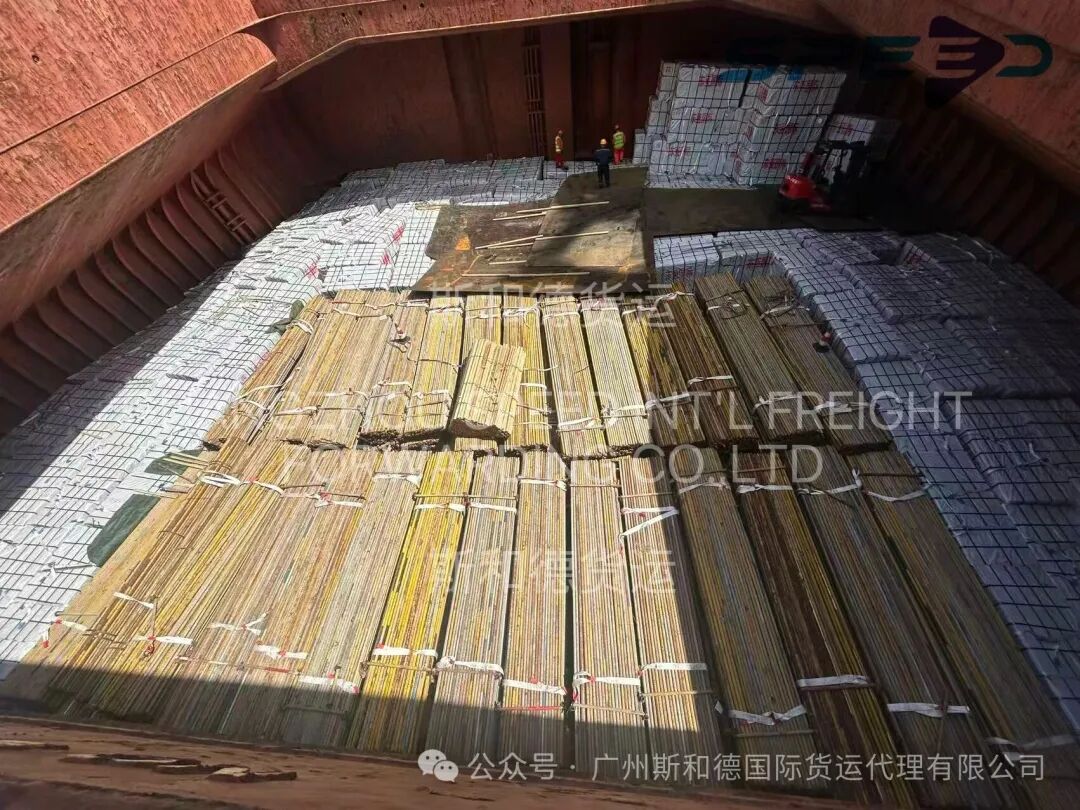 Neatly stowed steel cargo and non-stackable equipment inside the vessel hold